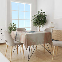 Beige horse-racing tablecloth covering a dining table with colorful illustration