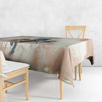 Beige horse-racing tablecloth draped over a table edge with colorful design