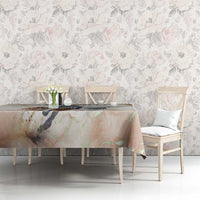 Beige horse-racing tablecloth on a dining table with colorful riders and horses