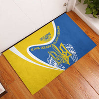 Blue and yellow rubber doormat with trident graphic and “Slava Ukraini” lettering