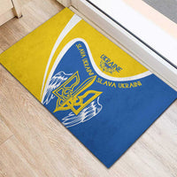 Yellow and blue rubber doormat showing trident emblem and curved “Slava Ukraini” text