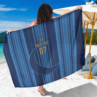 Dark blue custom sarong with geometric stripe pattern and crescent moon emblem