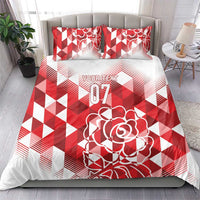 Red and white bedding set with geometric design, rose artwork, and 07 on duvet and pillows