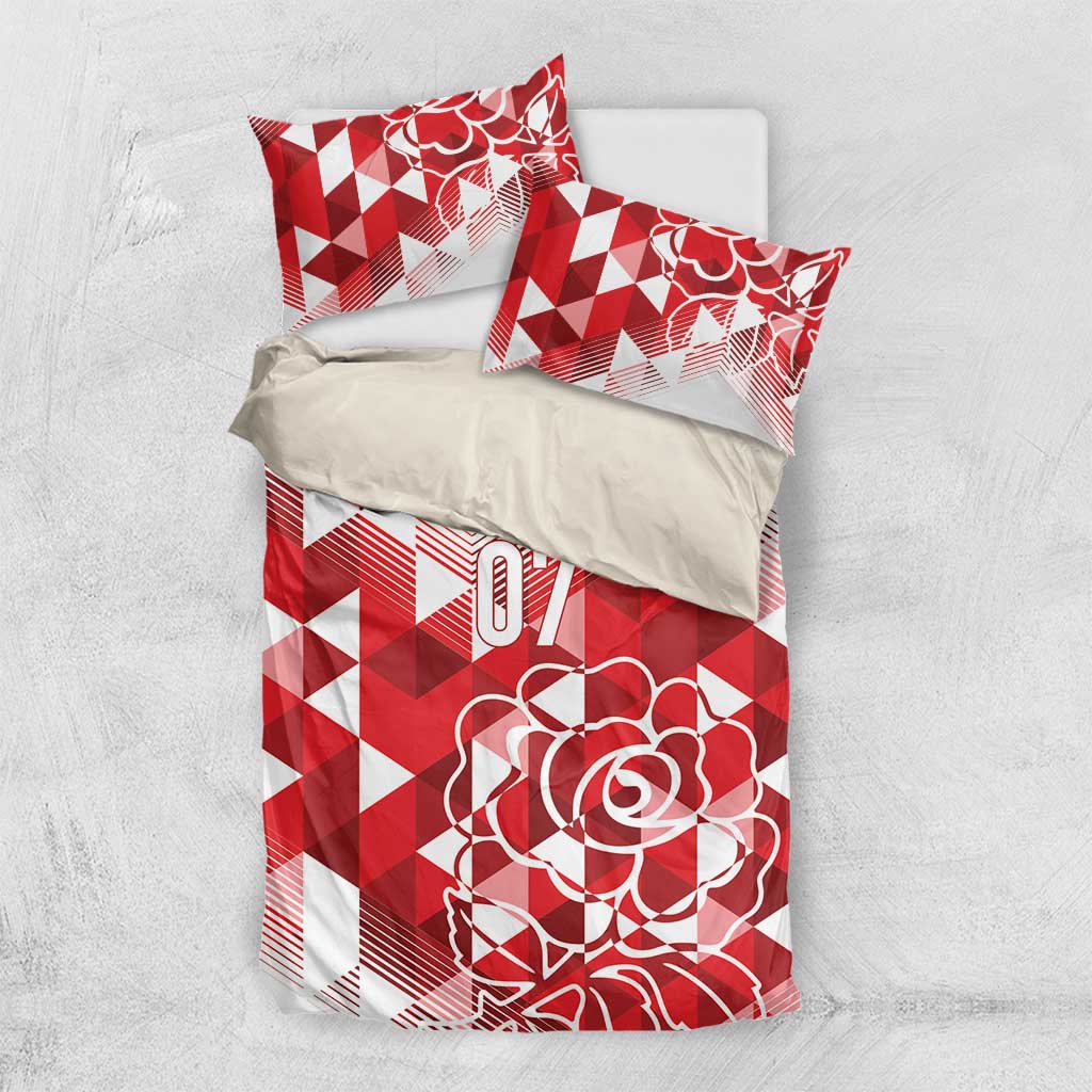 Red and white bedding set with geometric pattern, rose graphic, and two matching pillowcases