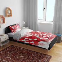 Red and white bedding set with geometric check design, rose artwork, and 07 on duvet