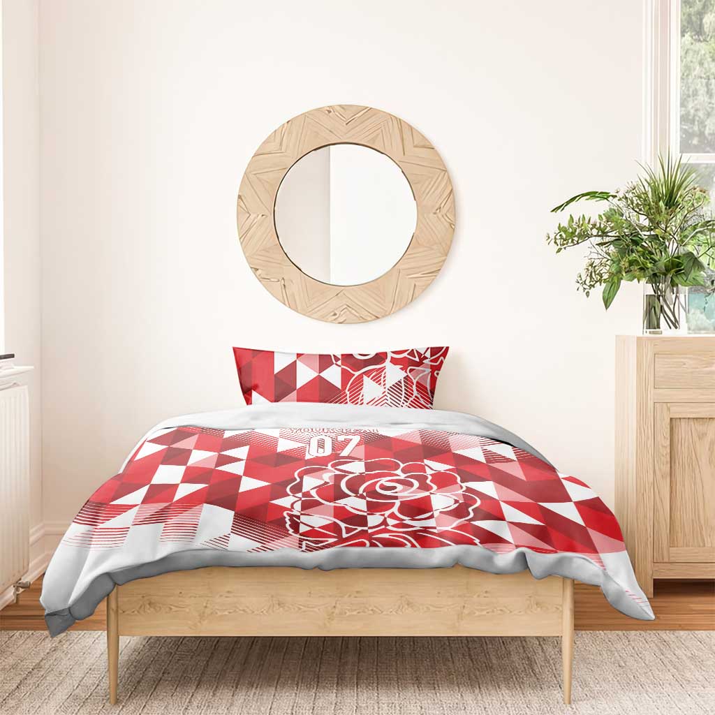 Red and white bedding set with geometric triangles, rose motif, and 07 on comforter