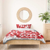 Red and white bedding set with geometric triangles, rose motif, and 07 on comforter