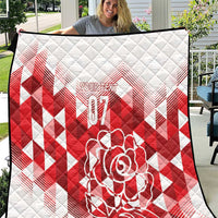 White and red quilt with diamond pattern, rose graphic, and centered “07” design