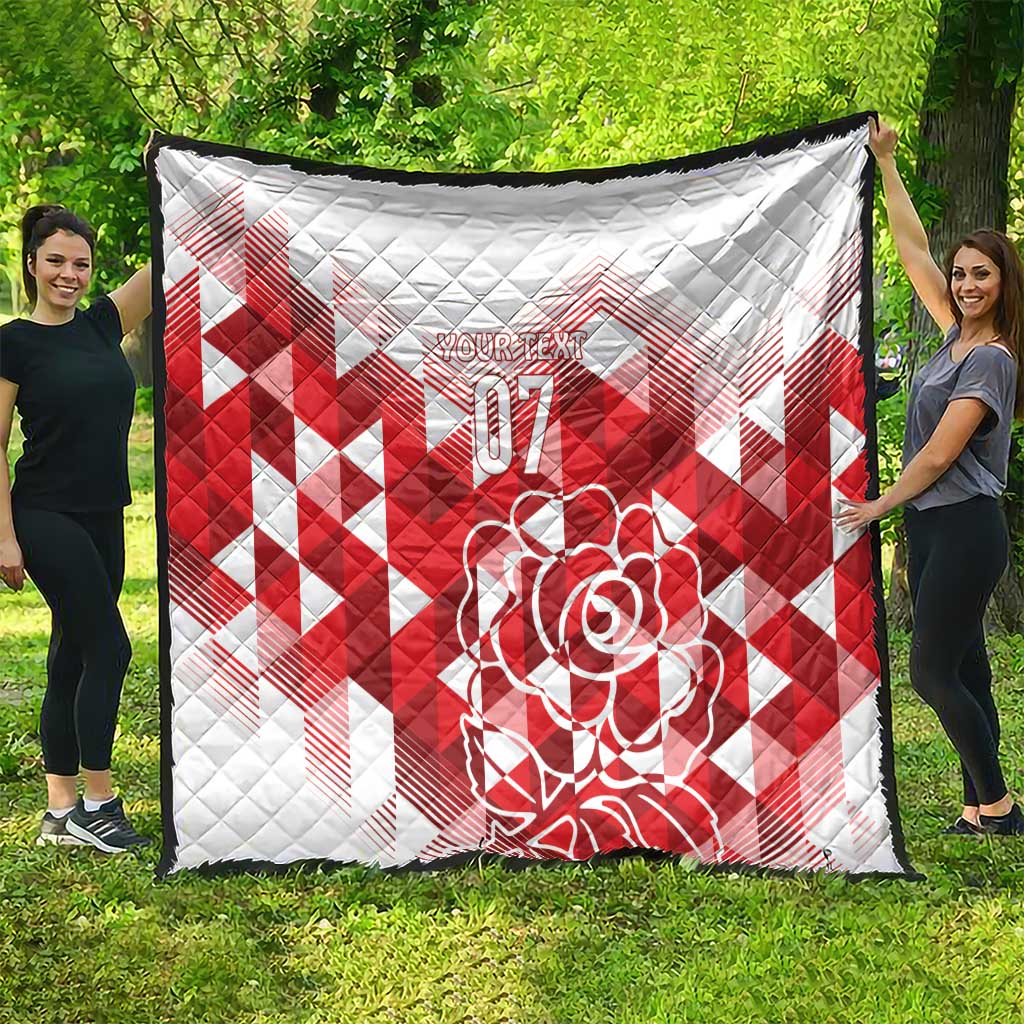 White and red quilt blanket with red diamond pattern and rose “07” artwork