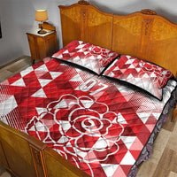 Red and white quilt bed set with rose motif and '07' plus 2 striped-trim pillowcases