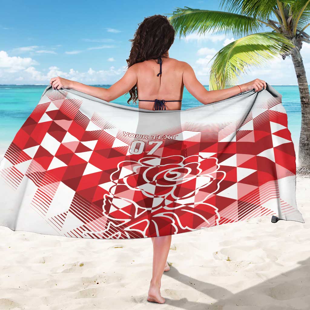 White sarong with red geometric pattern, large rose print and '07' across center