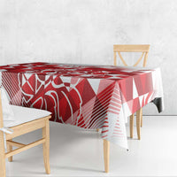 Red and white geometric tablecloth with a patterned overhang on a bench