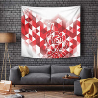 Red and white tapestry with geometric pattern and outlined rose graphic, hanging on wall