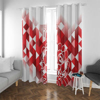 Red and white window curtain panels with diamond pattern and rose outline, hanging with rings