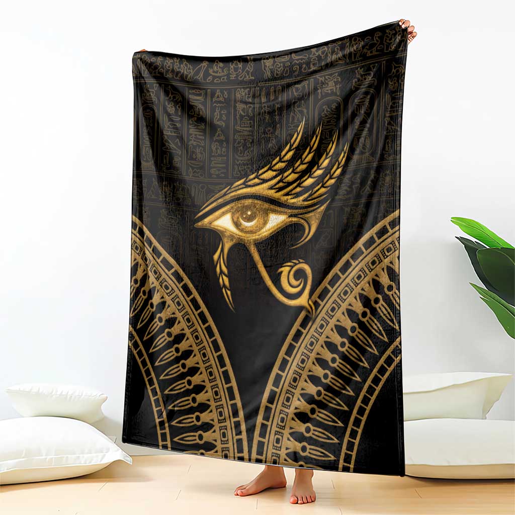 Black blanket with gold Eye of Horus and ornate feather wings design