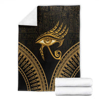 Eye of Horus gold feather motif blanket with matching folded white fabric
