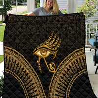 Black quilt with gold Eye of Horus feather design and ornate circular border