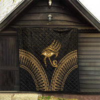 Black and gold Eye of Horus quilt hanging on barn wall, quilted arch borders