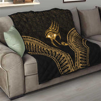Black and gold Eye of Horus quilt draped on sofa, gold arched feather border