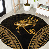 Round dark carpet with gold Eye of Horus feather center and geometric border
