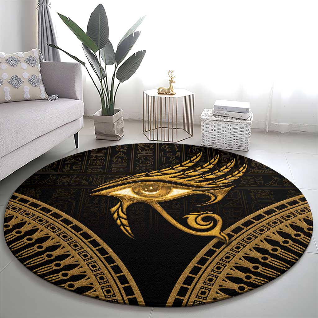 Round dark carpet with gold Eye of Horus feather motif and ornate border accents