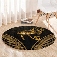 Round dark carpet with centered gold Eye of Horus feather design and patterned edge