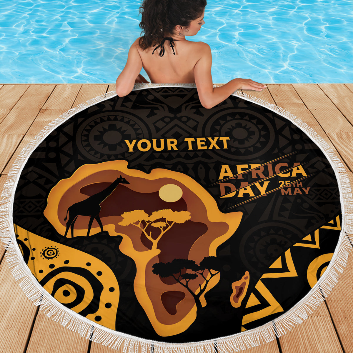 Round beach blanket with white fringe, black-and-gold Africa Day map and silhouettes
