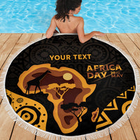 Round beach blanket with white fringe, black-and-gold Africa Day map and silhouettes