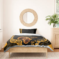 Personalized bedding set on bed: black and gold ethnic print with elephant art and “YOUR TEXT”