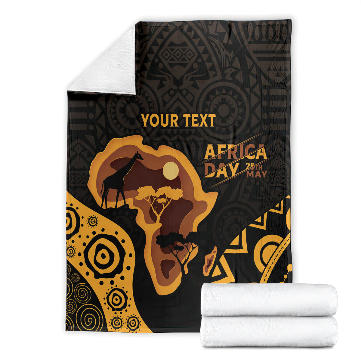 Folded Africa Day blanket with 'YOUR TEXT', black and gold graphics with two white towels.