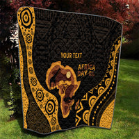 Personalized quilt on lawn with black and gold geometric design, Africa silhouette, 'AFRICA DAY'.