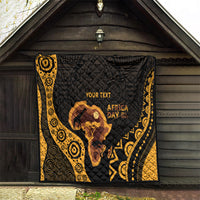 Personalized quilt hanging on porch in black and gold with Africa silhouette and 'AFRICA DAY'.