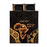 Quilt bed set with two black-and-gold pillows, Africa Day lettering, elephant graphic