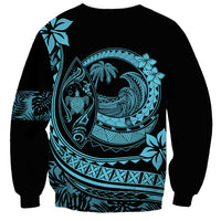 Black crewneck sweatshirt with turquoise Polynesian surf graphic on back