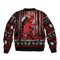 Black unisex Christmas bomber jacket with large red character graphic, striped print and ribbed cuffs