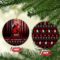 Black ceramic Christmas ornament with red Krampus print, hanging loop, 'Merry Krampus' text.