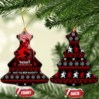 Hanging black ceramic Krampus Christmas ornaments with red striped knit pattern; front and back shown.