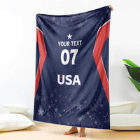 Folded navy USA-themed blanket with red stripe edges, stars, and 'YOUR TEXT 07 USA'