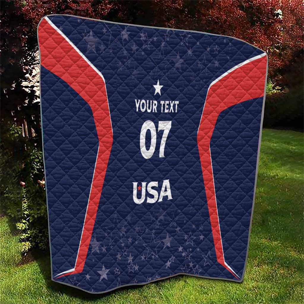 Navy blue quilt with red trim curves, white 07 and USA lettering, star pattern