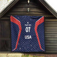 Blue and red quilt displayed indoors with white your text 07 and USA star design