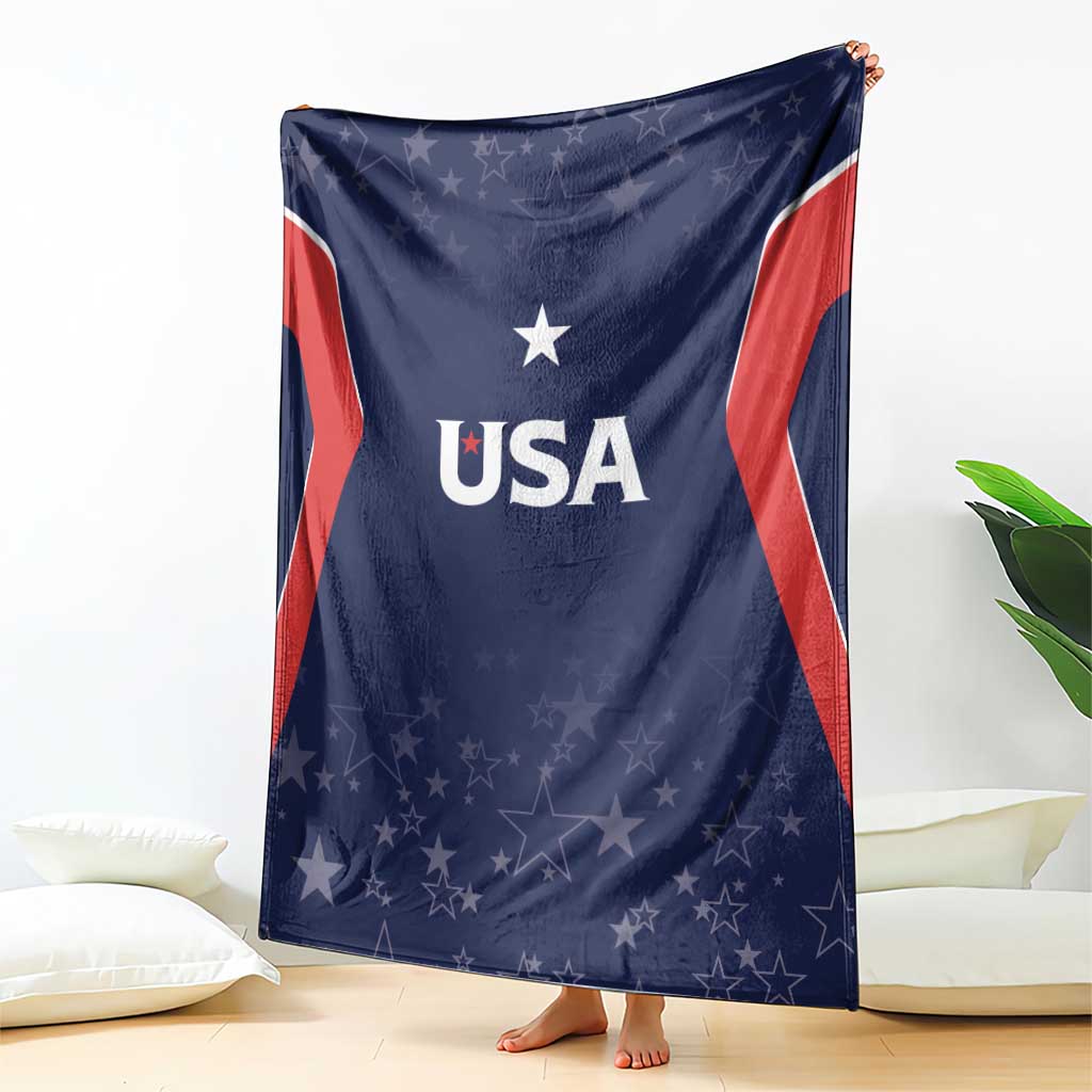 Navy USA-themed blanket with 'USA' text and star pattern, draped on floor