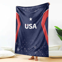 Navy USA-themed blanket with 'USA' text and star pattern, draped on floor