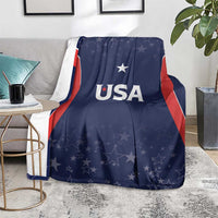 Navy USA-themed blanket with 'USA' text and star pattern, spread on floor rug