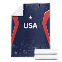 Folded navy USA-themed blanket with red/white flag sides, stars, and 'USA' text