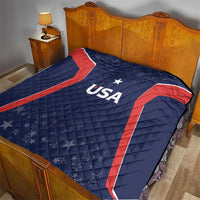 USA quilt blanket on bed, navy with red curved stripes, white star and USA text.