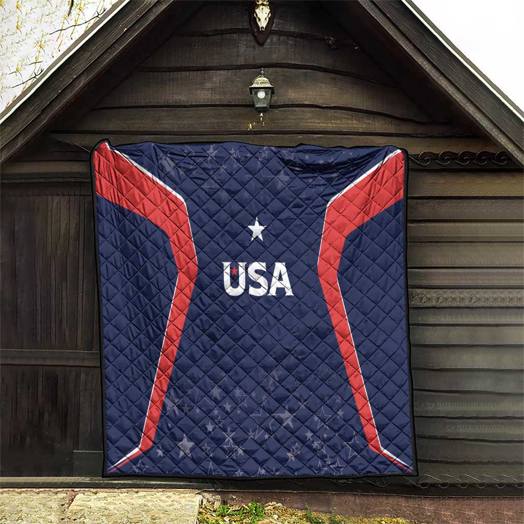 USA quilt blanket hanging in doorway, navy with red stripes, star and USA logo center.