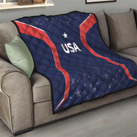 USA quilt blanket on sofa, navy with red accents and stars, central USA logo and star.
