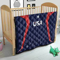 USA quilt blanket on baby crib, navy with red curved stripes, USA logo with star details.