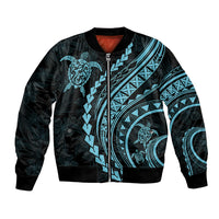 Black bomber jacket with aquamarine tribal turtle graphics, full zipper front, ribbed cuffs