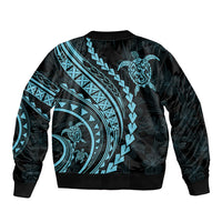 Black bomber jacket with aquamarine tribal turtle graphic on back, ribbed collar and cuffs